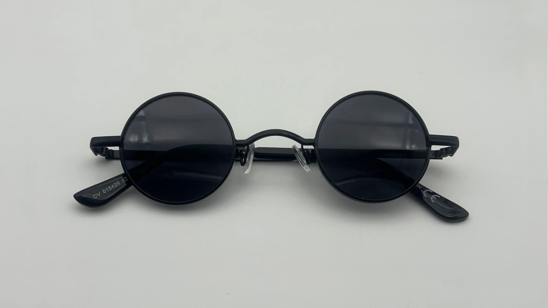 Lunettes Rondes Noir - Dessus Lunettes de soleil rondes noir verres noirs vue dessus
