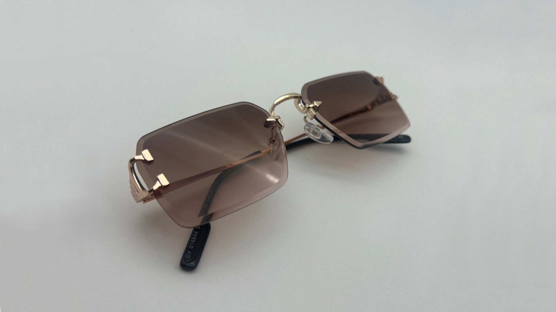 Lunettes Sans Monture Verres Marron Dégradé - Pliées Lunettes de soleil sans monture verres marron dégradé pliées