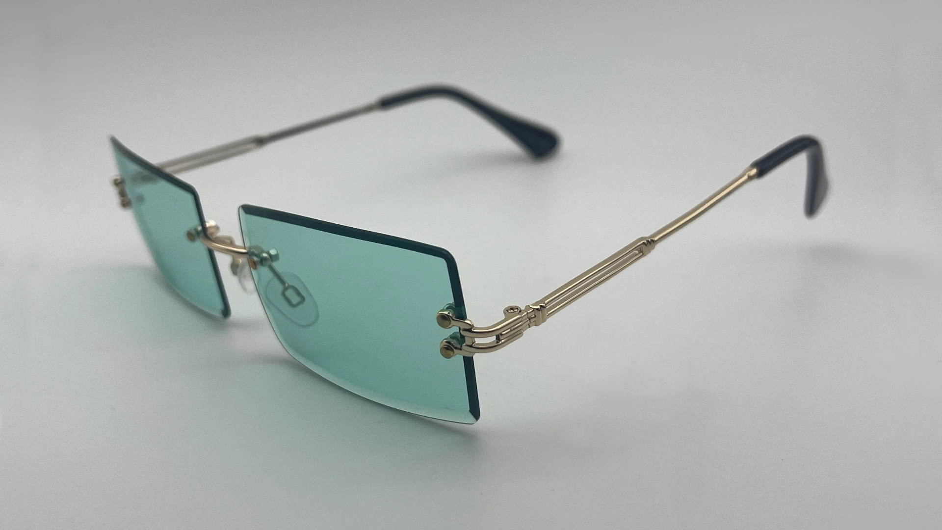 Lunettes Sans Monture Verres Vert Eau - Côté Lunettes de soleil sans monture verres vert eau vue côté